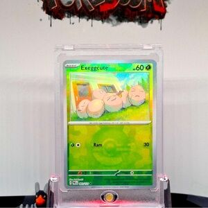 Exeggcute Pokeball Holo 001/131 - NM Prismatic Evolutions Pokemon